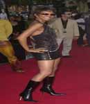 Halle Berry in short leather skirt and high heels