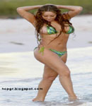 Mariah Carey walks on beach bikini