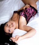 Salma Hayek in bed wearing pink
