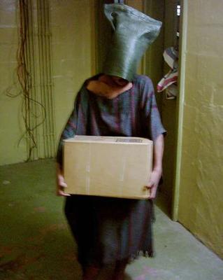 Black hooded prisoner at Abu Gharib prison in Iraq, in newly released photo not shown in U.S. media