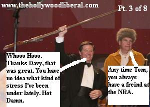 Tom Delay and a guy in a coonskin cap about to have some fun at the NRA Meeting 041605