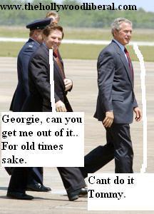 Tom Delay is escorted to the plane by President Bush, and a security guard 042705