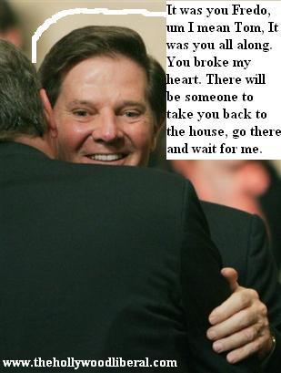 Tom Delay gets a hug from President Bush 042705