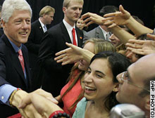 Bill Clinton meet with admireres after a speech in which he called Bush's policy Dumb Economics 050205