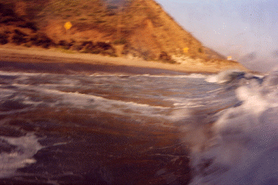 I uses a Nikonos V, underwater camera to take this on my boogeyboard, just before I dropped down the barrel of a wave Near Malibu Beach Ca.